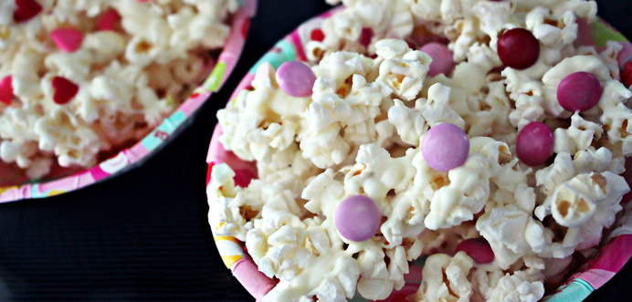 White popcorns with chocolate and heart sprinkles